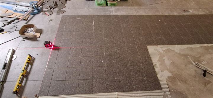 Laser line used to set out floor tiles in a shop