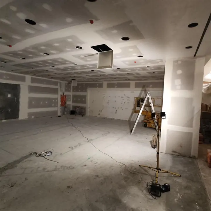 Shop unit with a new plasterboard ceiling sheeted and set