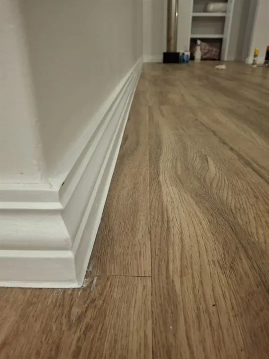Tall skirting boards fitted along a new timber-look floor