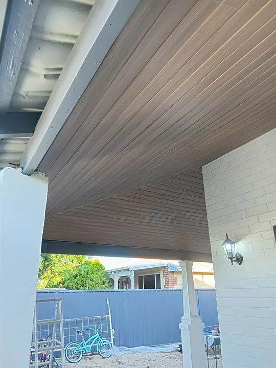 Verandah ceiling lined in timber-look boards